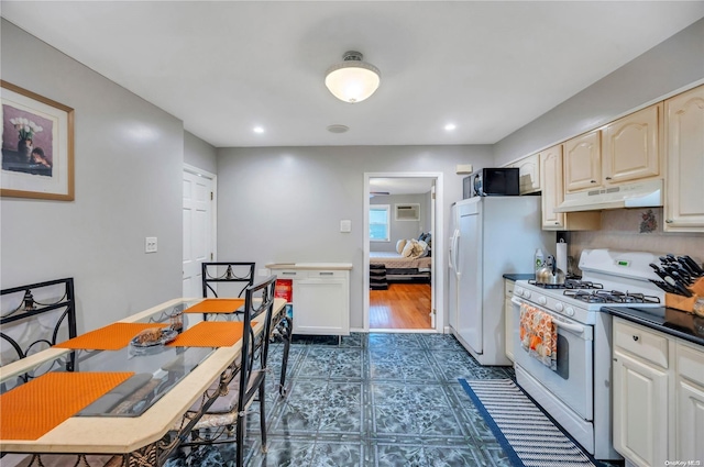 kitchen with dark wood-type flooring and white appliances