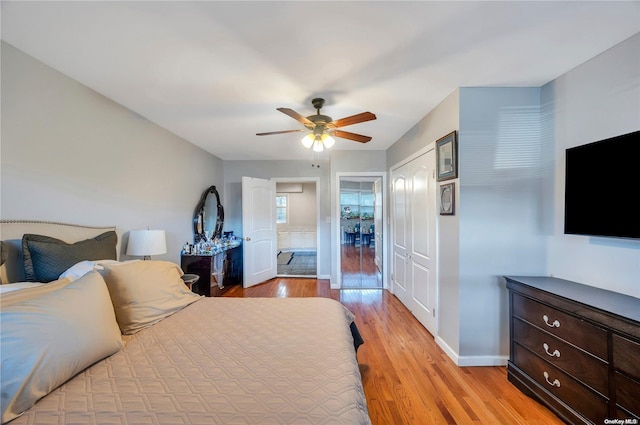 bedroom featuring light wood-type flooring and ceiling fan