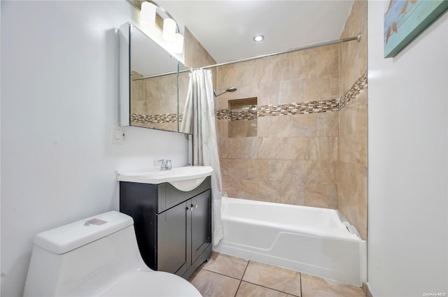 full bathroom with tile patterned flooring, vanity, toilet, and shower / bath combo with shower curtain