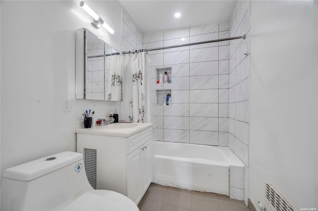 full bathroom with tile patterned floors, vanity, shower / tub combo, and toilet