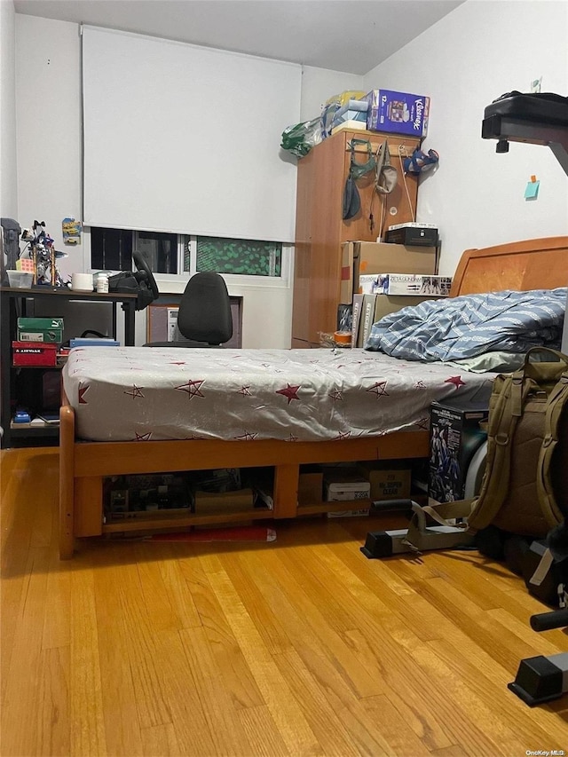 bedroom featuring wood-type flooring