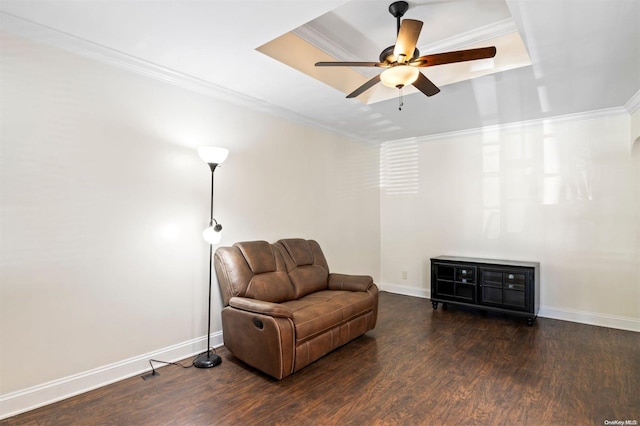 sitting room with ceiling fan, dark hardwood / wood-style flooring, and crown molding