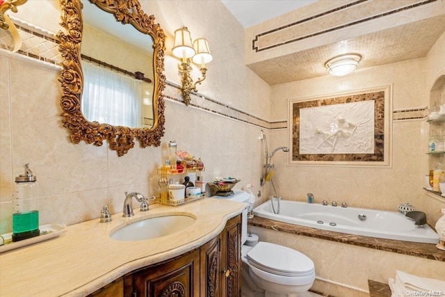 bathroom featuring vanity, a relaxing tiled tub, toilet, and tile walls