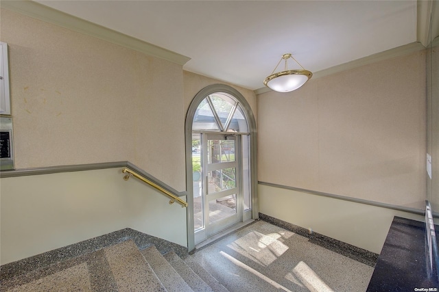 interior space with crown molding