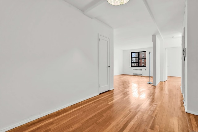 interior space featuring radiator and light hardwood / wood-style flooring