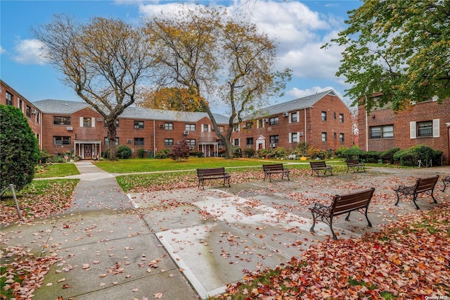 view of property's community with a lawn