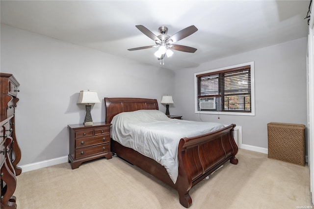 bedroom featuring ceiling fan, cooling unit, and light carpet