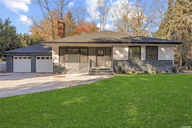 view of front facade with a front lawn and a garage