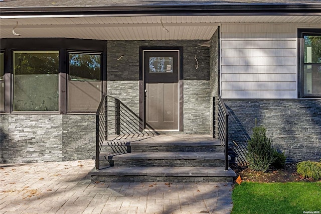 property entrance featuring covered porch