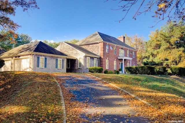 view of front facade with a garage and a front yard