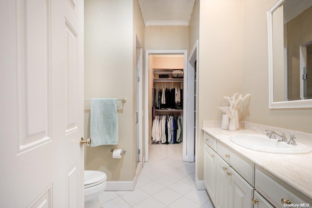 bathroom featuring crown molding, vanity, toilet, and tile patterned flooring