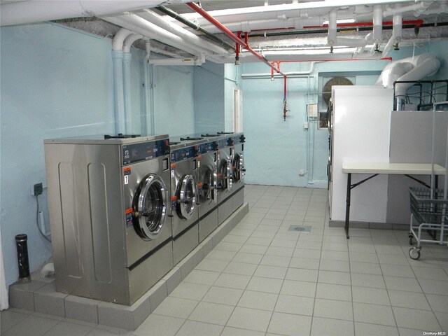 212-30 23rd Ave Unit 6A, Bayside, NY 11360 - below grade area featuring washing machine and clothes dryer
