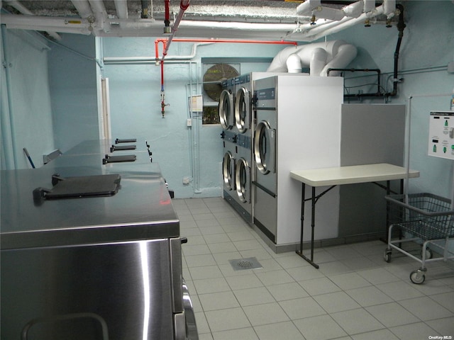212-30 23rd Ave Unit 6A, Bayside, NY 11360 - laundry area with washing machine and dryer and light tile patterned floors