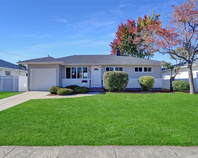 ranch-style home featuring a garage and a front yard