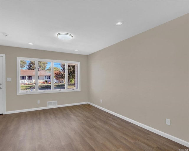 unfurnished room featuring wood-type flooring