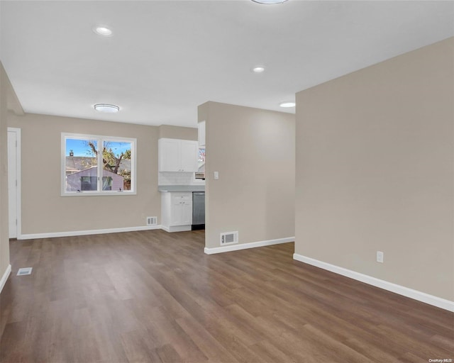 unfurnished living room featuring wood-type flooring