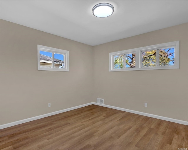 unfurnished room featuring light hardwood / wood-style flooring