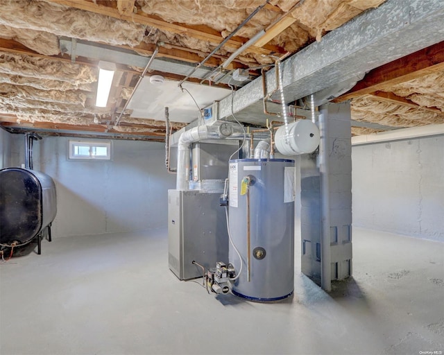 basement featuring gas water heater and heating unit