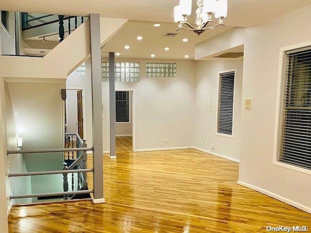 25-54 37th St, Astoria, NY 11103 - spare room featuring a chandelier, wood finished floors, and recessed lighting