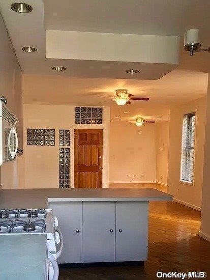 25-54 37th St, Astoria, NY 11103 - kitchen featuring dark wood finished floors, recessed lighting, and white range with gas cooktop