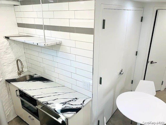 25-54 37th St, Astoria, NY 11103 - bathroom with tasteful backsplash and a sink