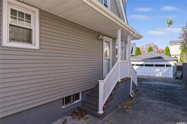 view of side of property with a garage and an outdoor structure