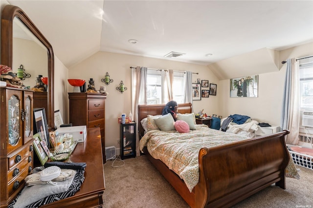 bedroom with multiple windows, light colored carpet, and vaulted ceiling