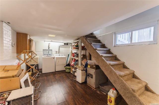 basement with washing machine and dryer and dark wood-type flooring