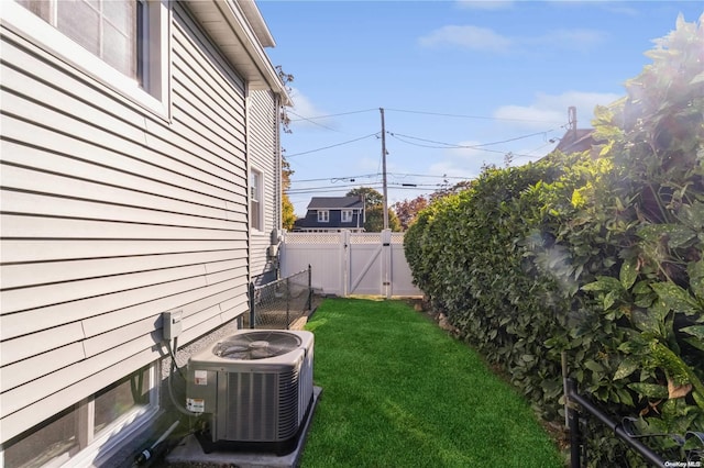 view of yard with central air condition unit