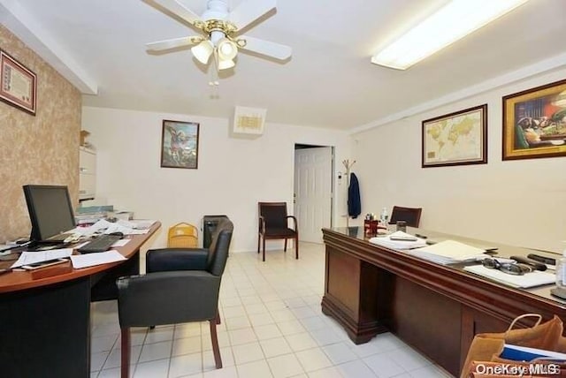 tiled home office featuring ceiling fan