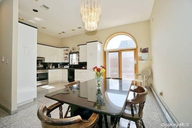 dining room featuring baseboard heating and a chandelier