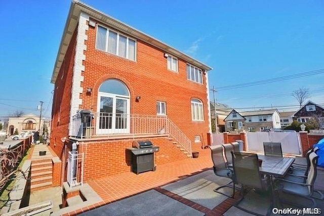 rear view of property with a patio