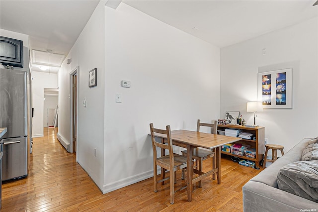 dining area with light hardwood / wood-style floors