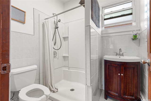 bathroom with walk in shower, vanity, toilet, and tile walls