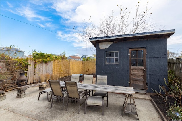 view of patio / terrace featuring an outbuilding