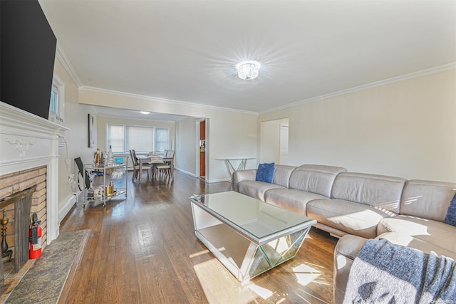 living room featuring crown molding, a fireplace, and dark wood-type flooring