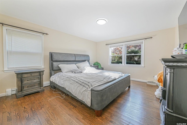 bedroom featuring dark hardwood / wood-style floors and baseboard heating