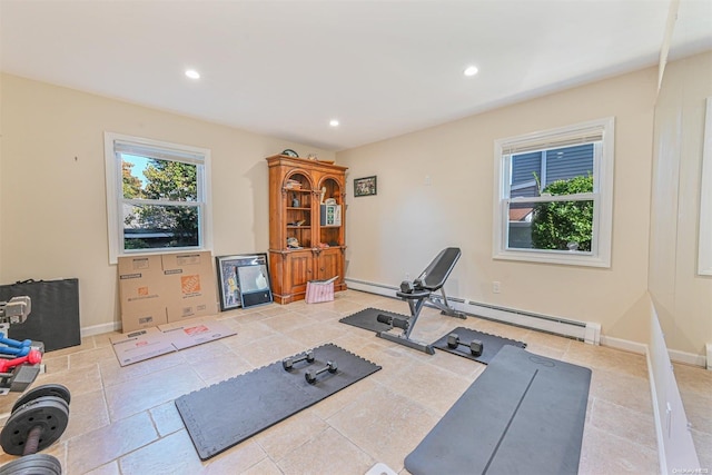 workout area with a baseboard heating unit