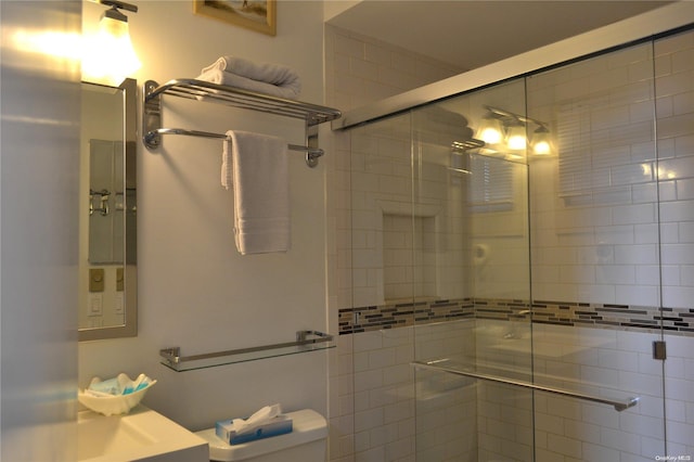 bathroom with toilet and walk in shower