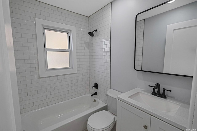 full bathroom featuring toilet, vanity, and tiled shower / bath