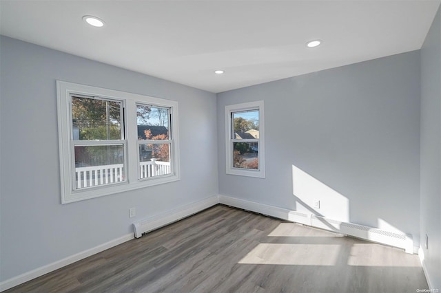 empty room with hardwood / wood-style floors