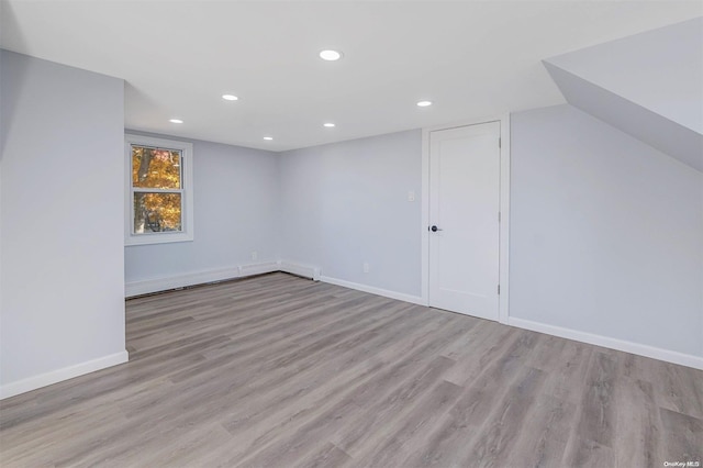 additional living space with light wood-type flooring