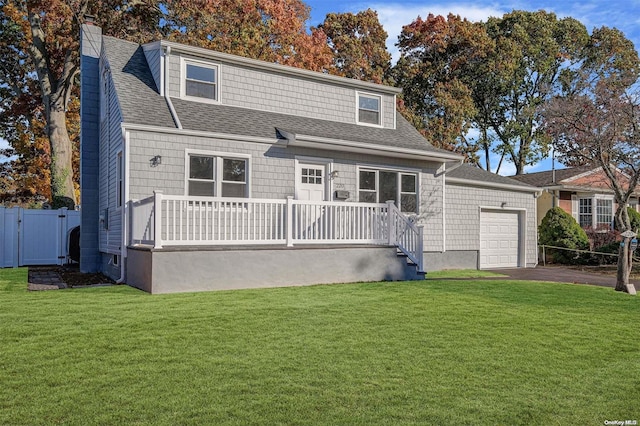 view of front facade with a garage and a front lawn