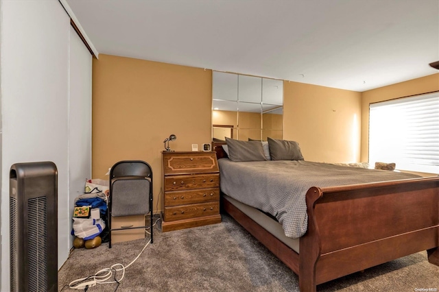 carpeted bedroom featuring a closet