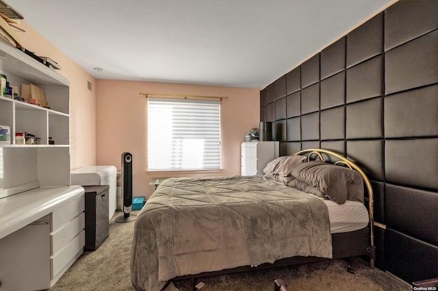 bedroom featuring light colored carpet