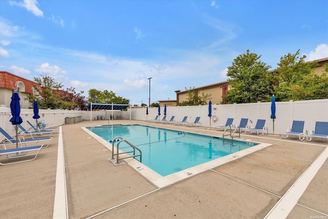 view of swimming pool with a patio area