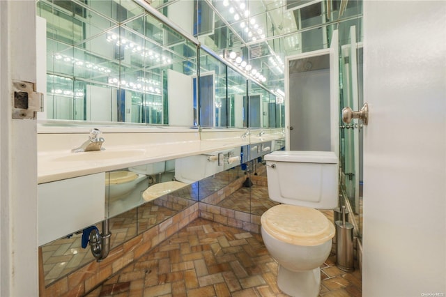 bathroom featuring toilet and sink