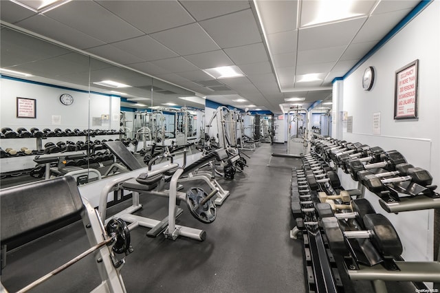 gym featuring a drop ceiling