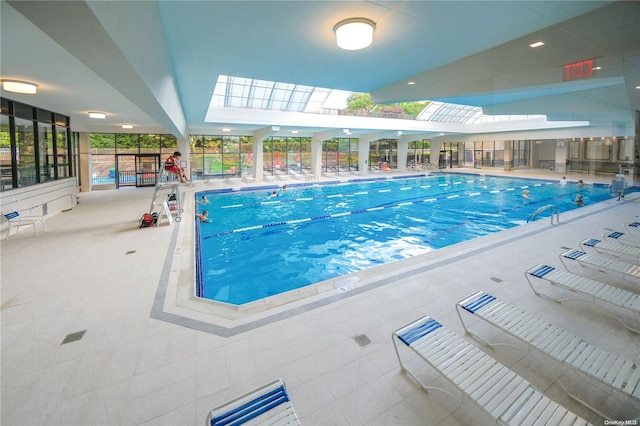 view of swimming pool with a skylight