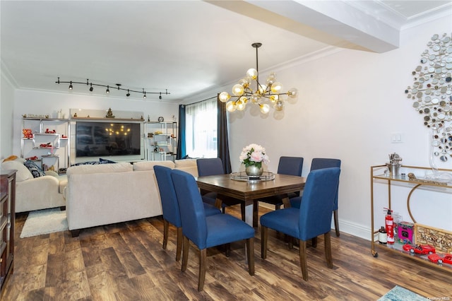 dining area featuring ornamental molding, dark hardwood / wood-style floors, and a notable chandelier